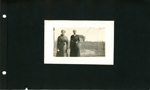 women standing in yard by farm