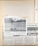 newspaper clipping - farmer in field with office building behind