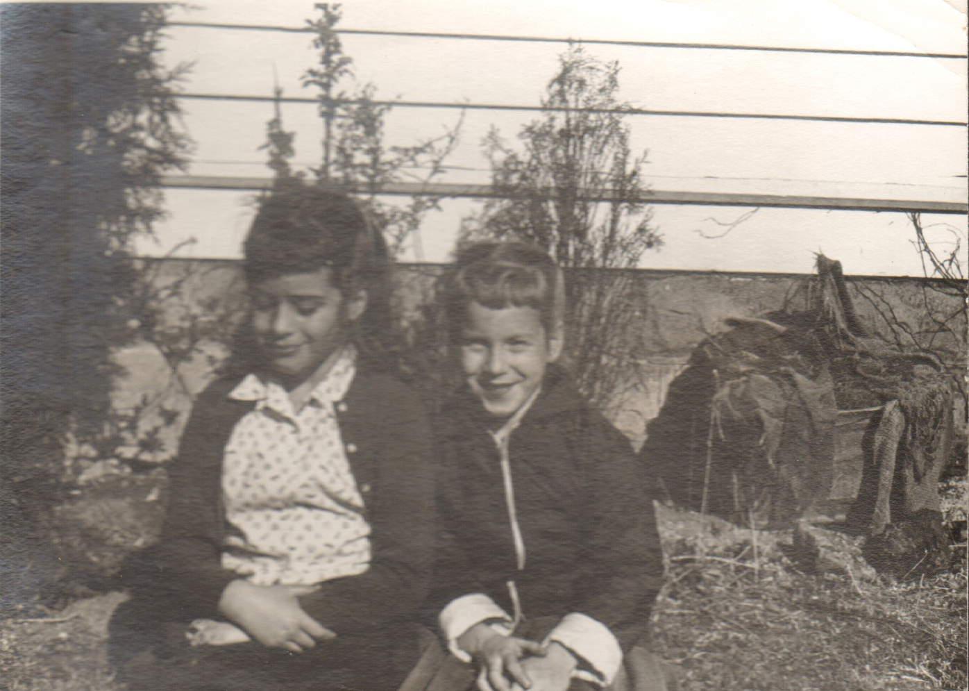 Susan and friend sitting by 6122 outside