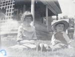 Picture from negative - looks like baby Rosemary in hat.