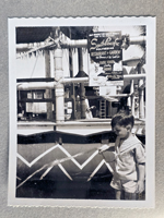 South Pacific Polynesian Restaurant - Alan by outdoor bamboo area and poster