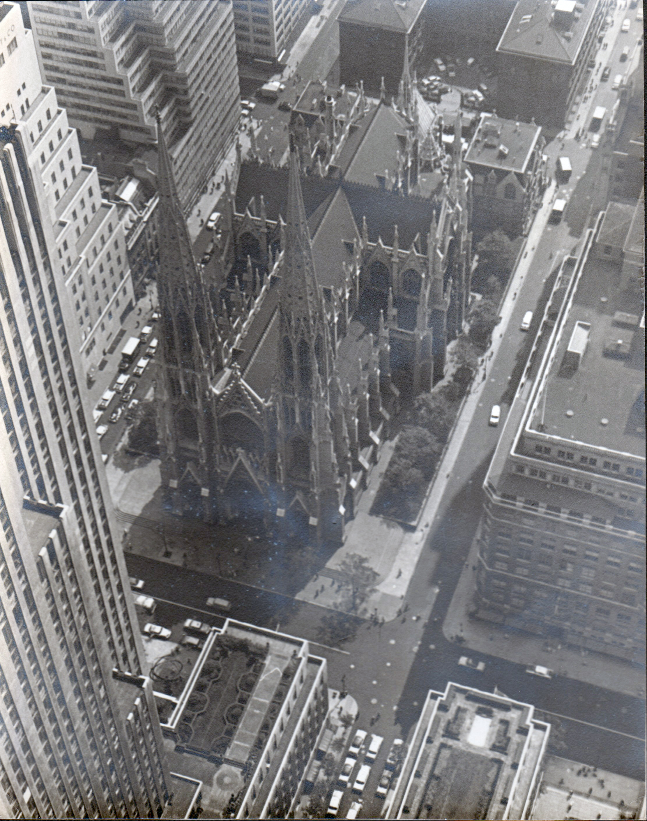 Looks like a church in Manhattan taken from tall building - August 16 1956 stamped on back
