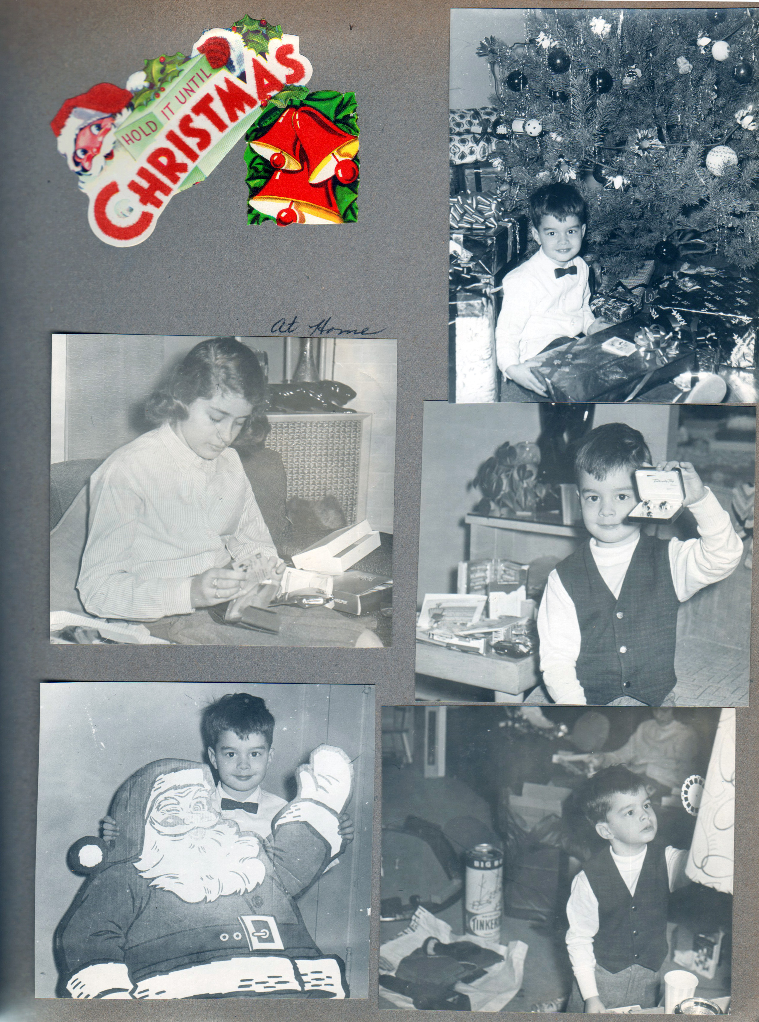 Christmas - Hold it until Christmas sticker. Alan with presents at tree. Susan opening presents in living room. Alan with cardboard Santa. Alan with Viewmaster and Lincoln Logs.