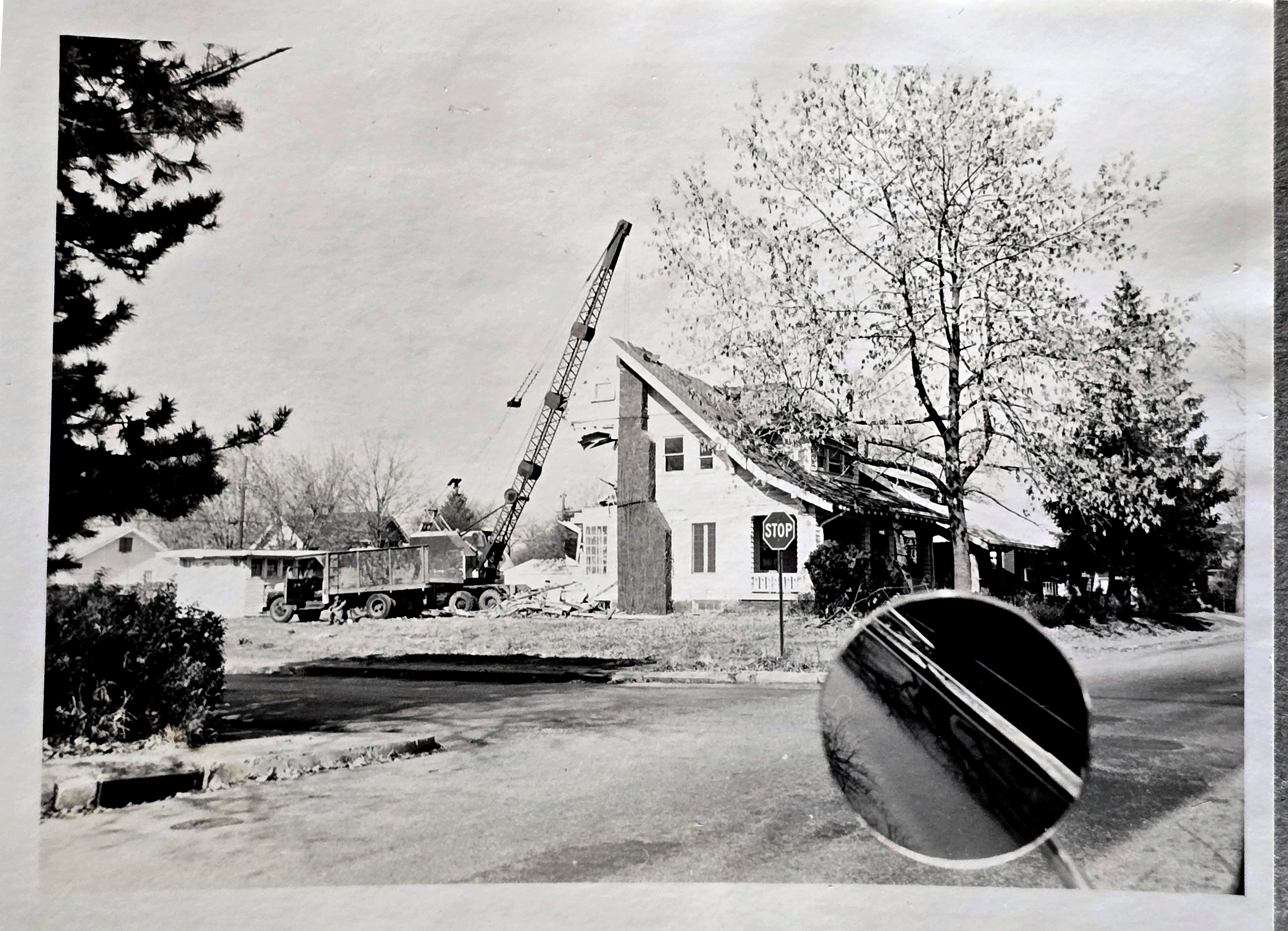 crane at 61st and Carrollton for apartments - razing minister's house at 6108 Rev Otho Blackburn