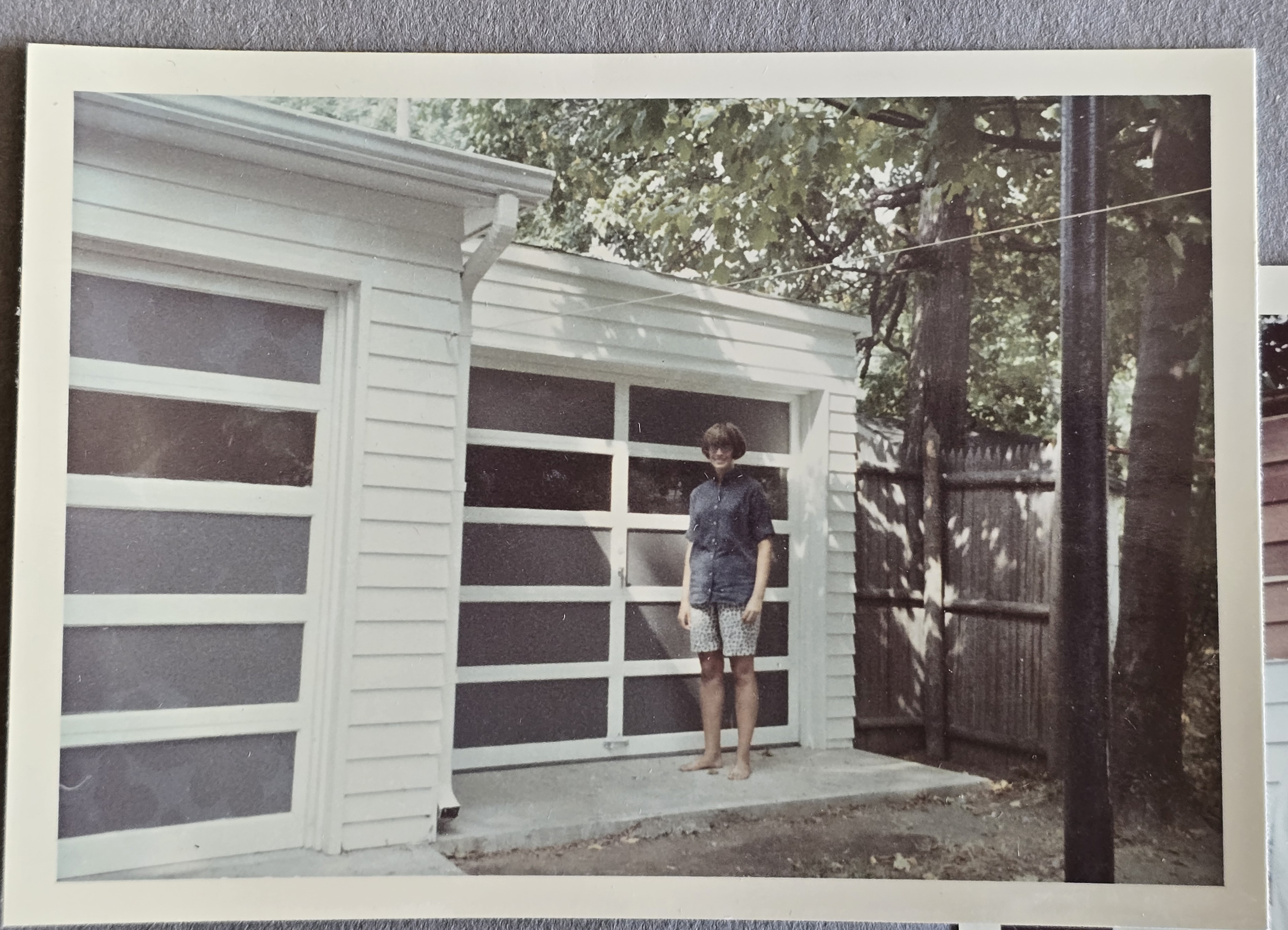6122 north garage - Susan in front of finished garage