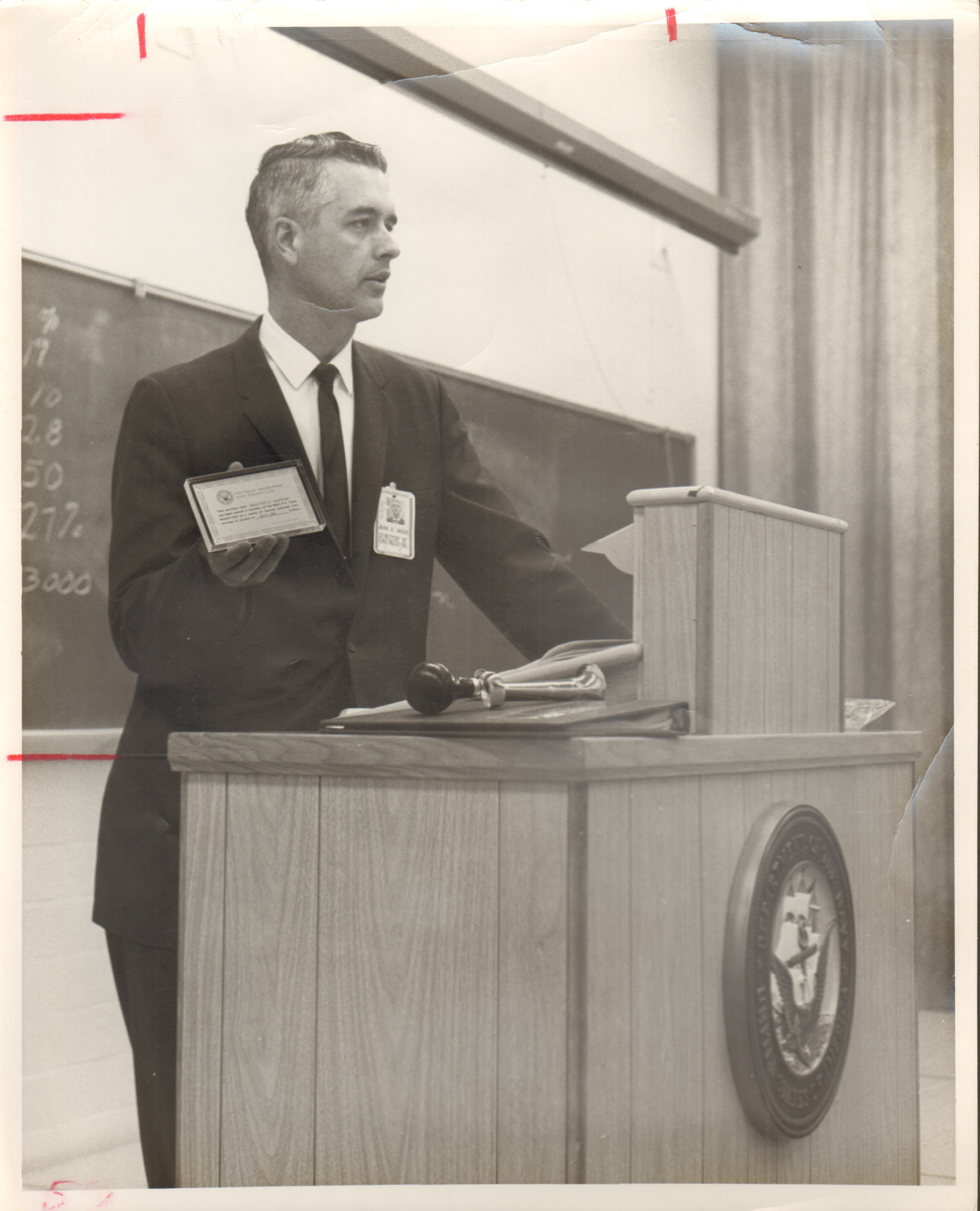 Navy photo 36104 John D Hague at podium with paperweight