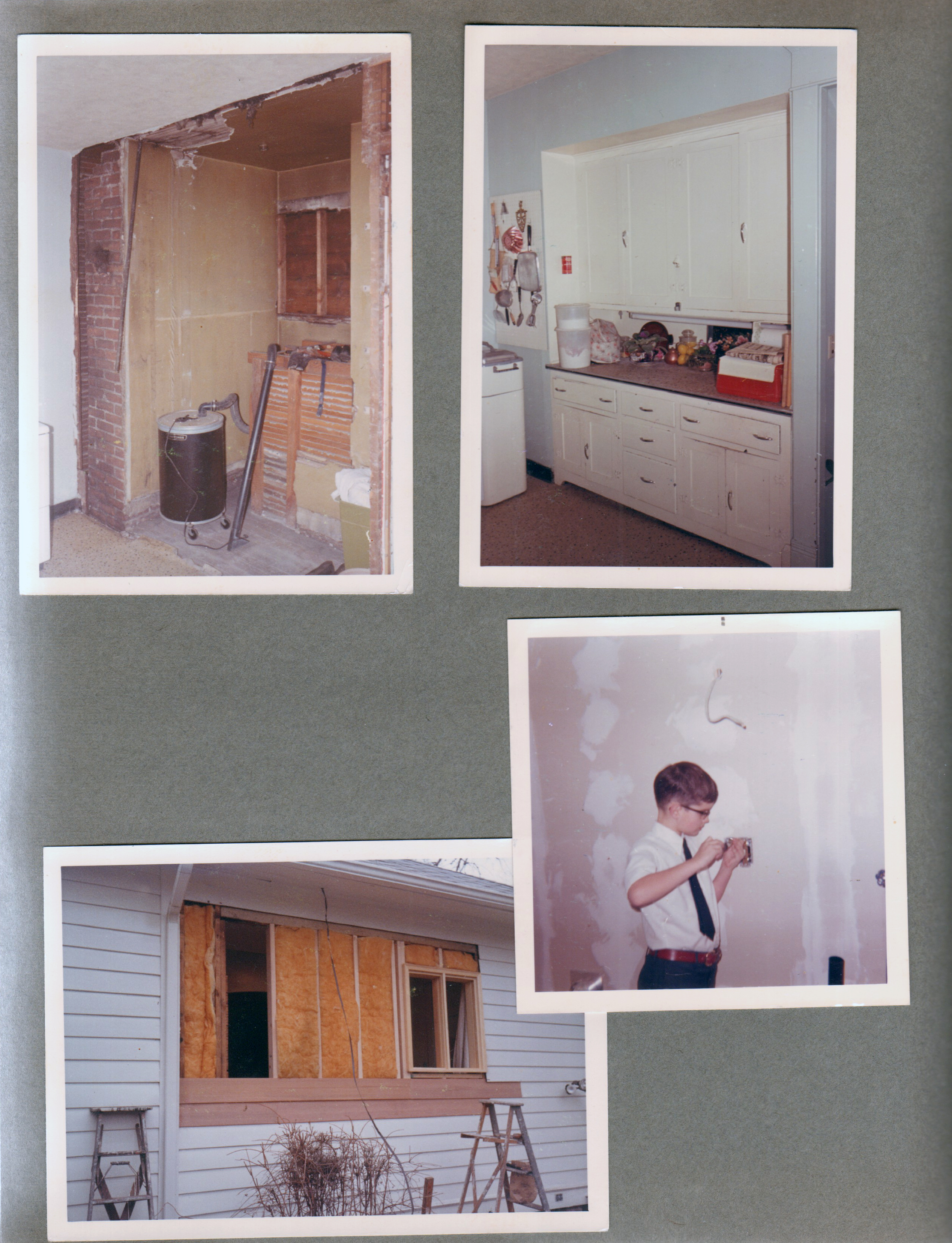 6122 kitchen remodel - cabinets before. Filling in windows on west wall. Alan screwing in electrical box