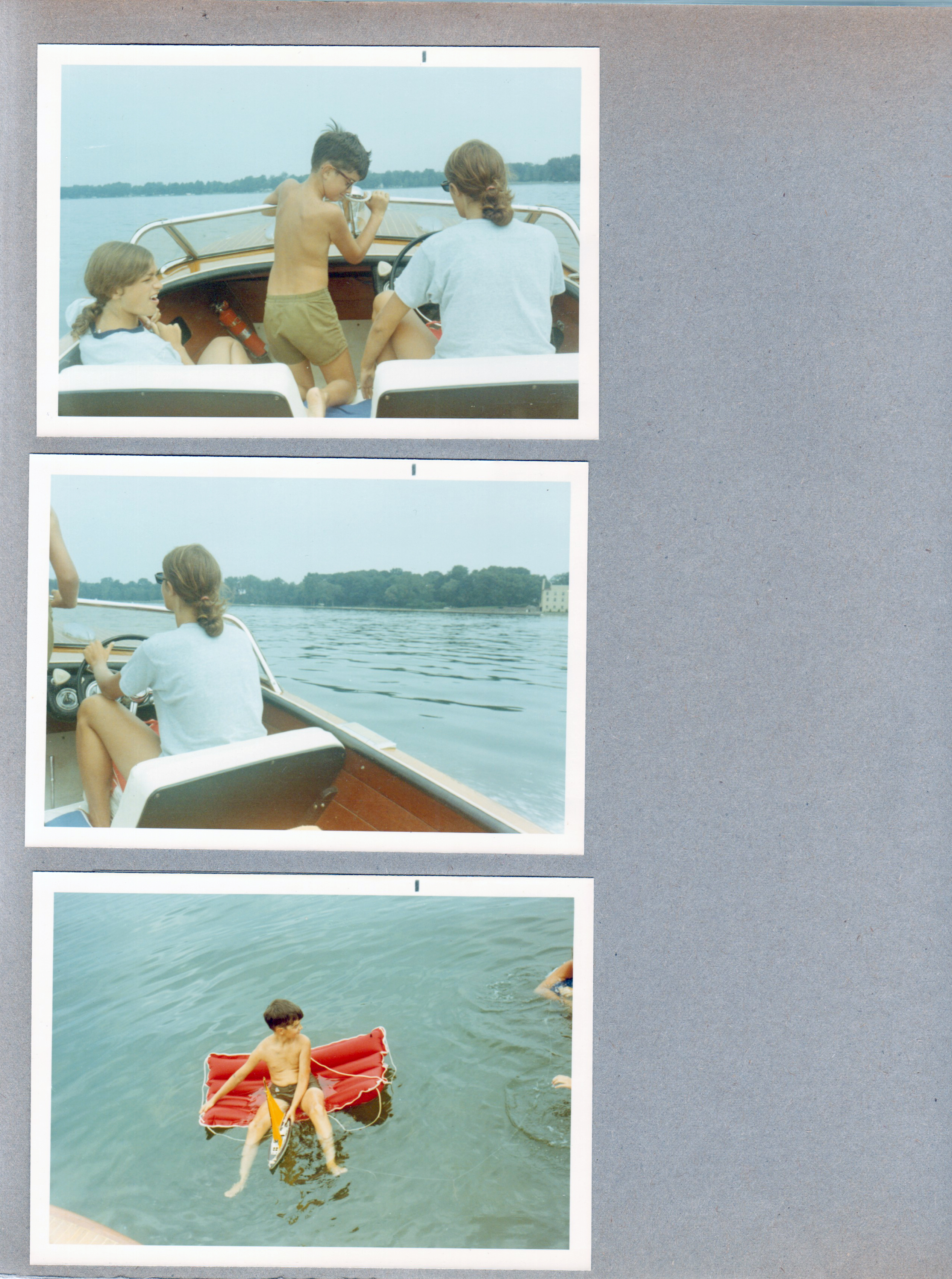 Wawasee - Chris Craft - Susan Tuck, Alan, Susan driving. Alan on raft with toy sailboat.