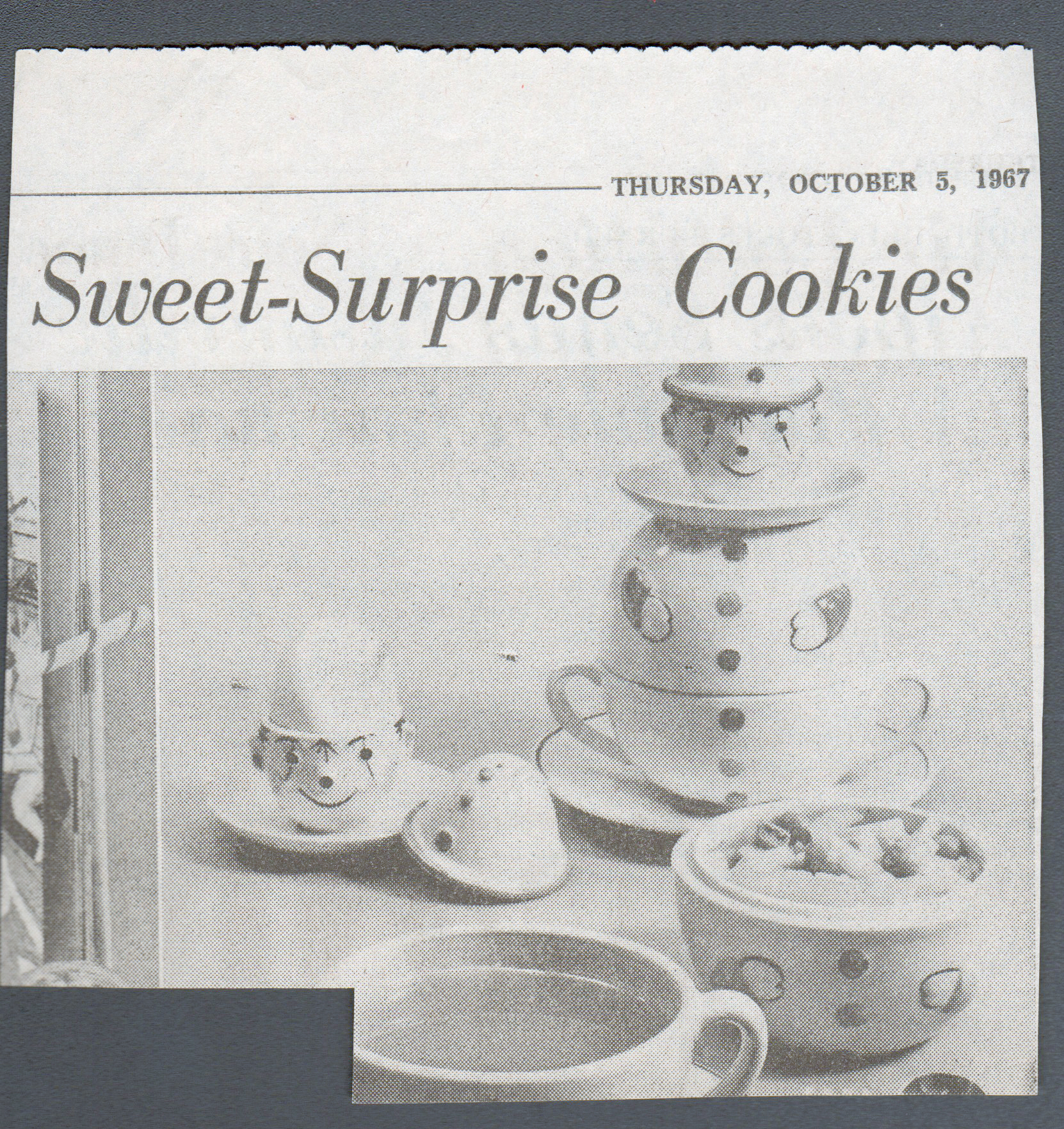newspaper clipping - cookie jar and mug set that John had as a child (in attic now)
