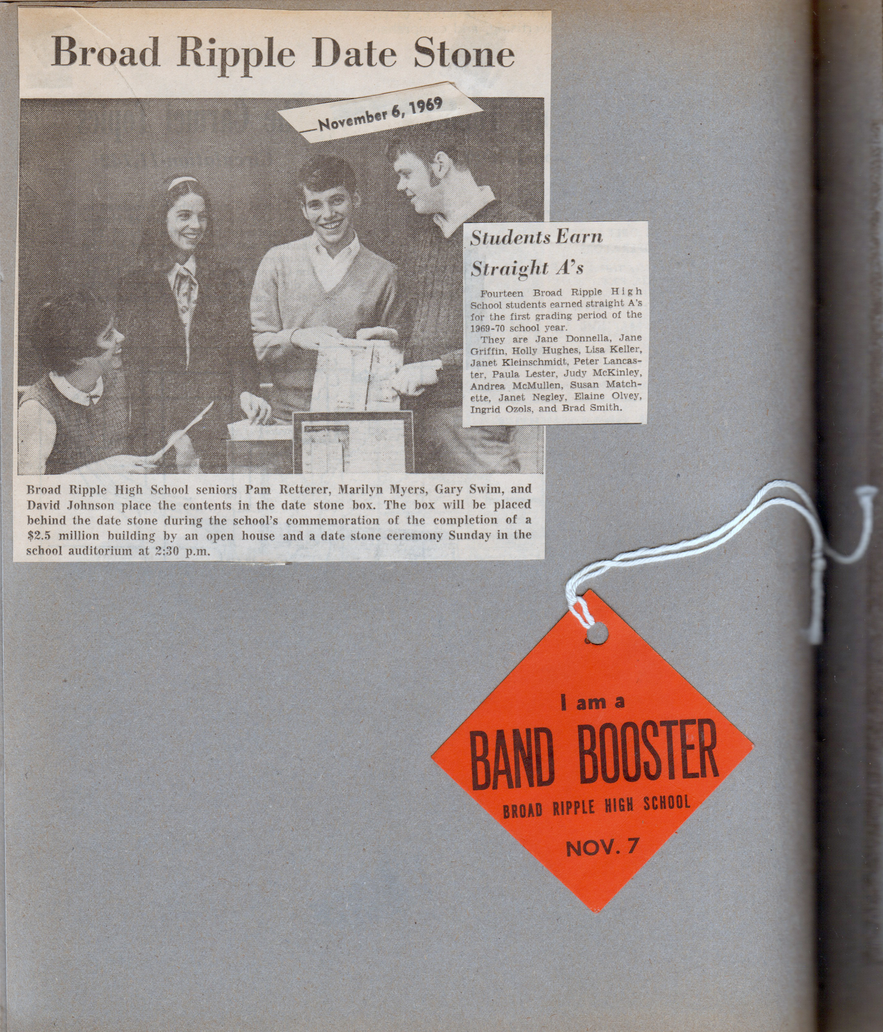 newspaper clipping - BRHS date store box. BRHS I am a Band Booster tag from parade.