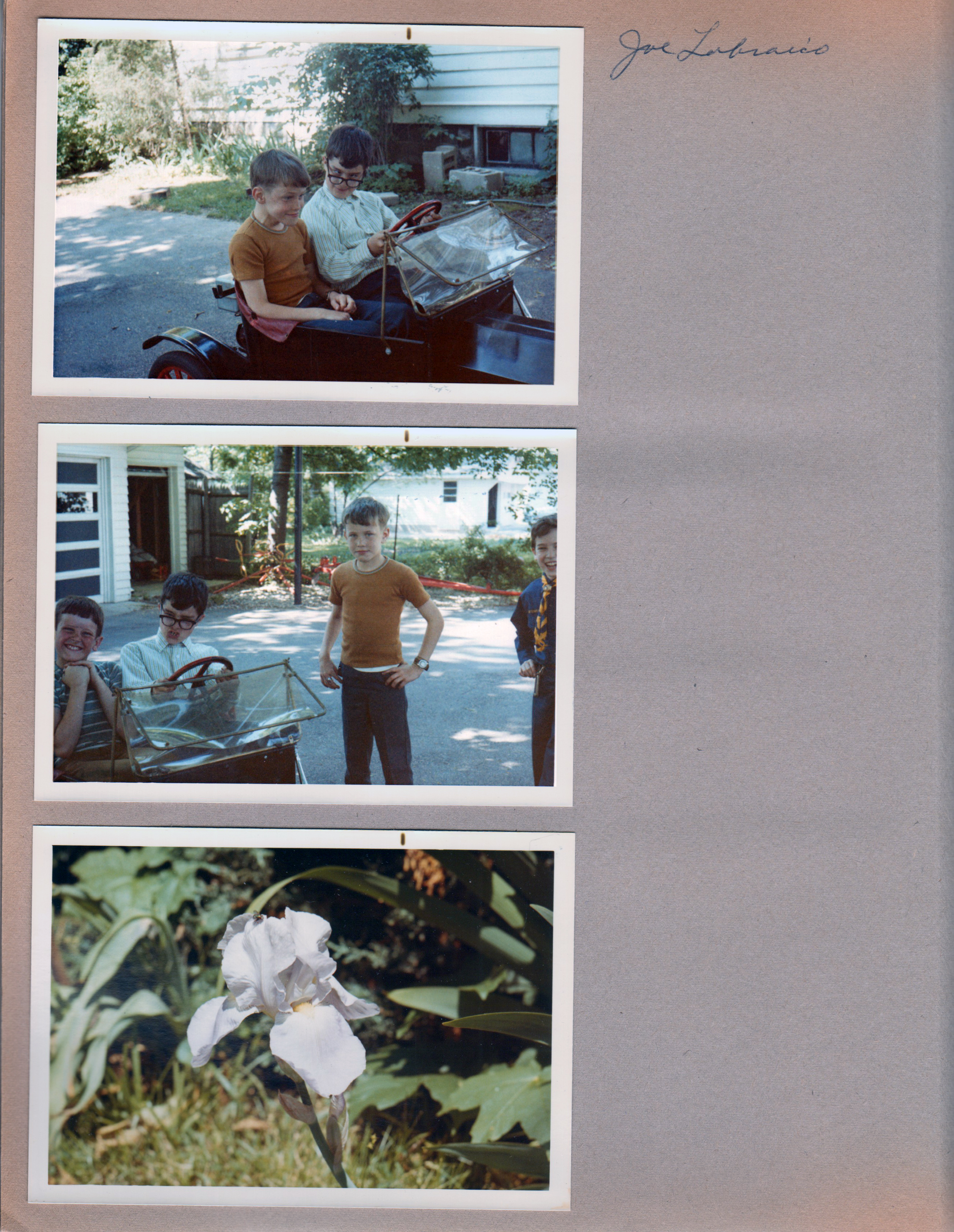 6122 driveway - Joe Lobraico and Alan in little car. Iris in yard.