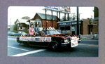BRHS Homecoming parade passing by Walker Cleaners and Chelsea's on Broad Ripple Avenue - Kim Mitchell and Jeff ??? - Orange Aid float.